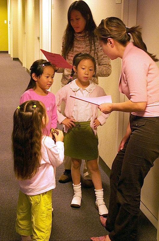 Director Joyce Lee with child voice actors and child parent.