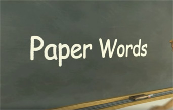 The title of the film, Paper Words, written in chalk on a chalkboard